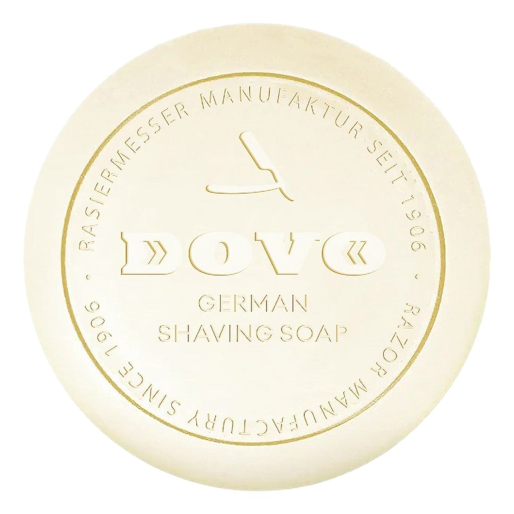 Bar of Dove German Shaving Soap with gold text on a white background