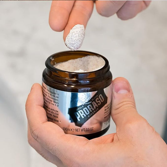 Person holding a Proraso Beard Exfoliating Paste, Mint & Rosemary, 100ml