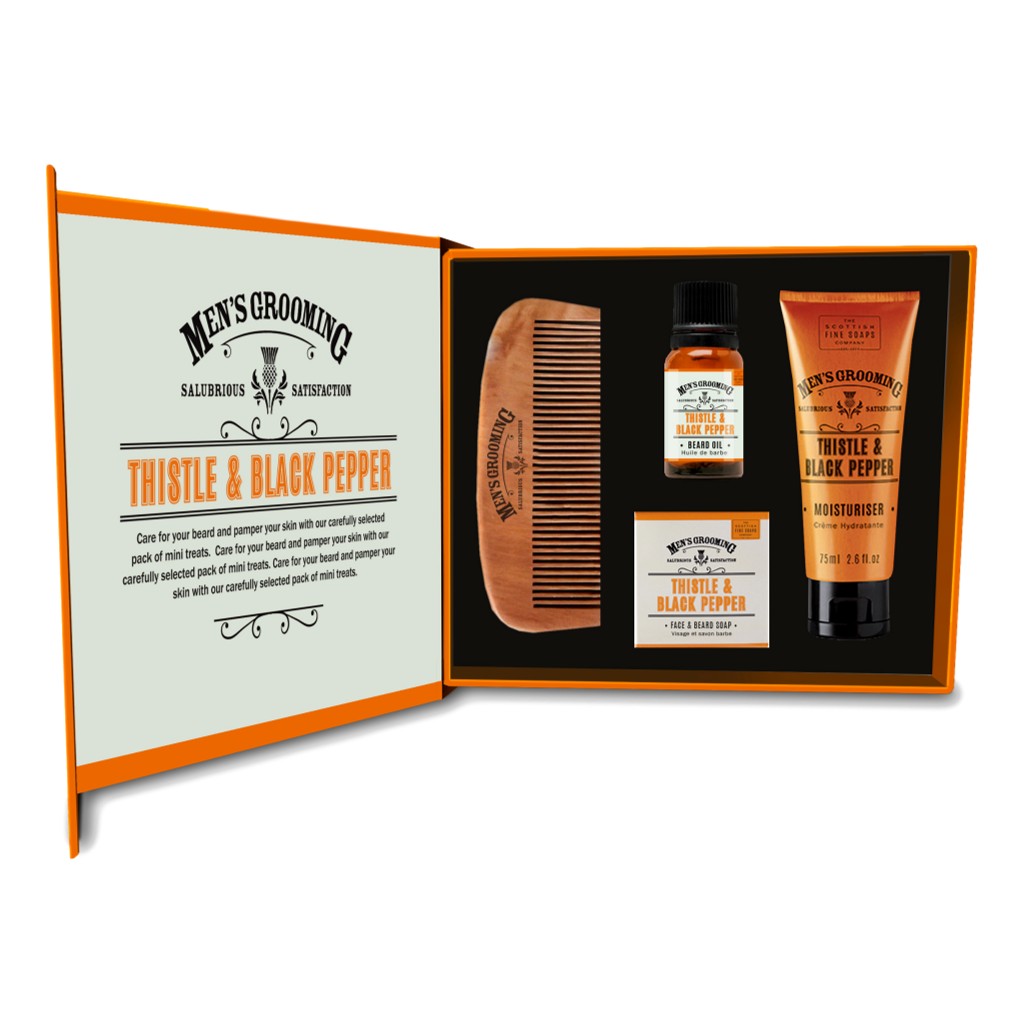 The Scottish Fine Soaps Company Men’s Grooming Face & Beard Care Kit featuring Thistle & Black Pepper fragrance. Includes beard oil, face & beard soap, moisturiser, and a branded hardwood beard comb, presented in a stylish gift box.