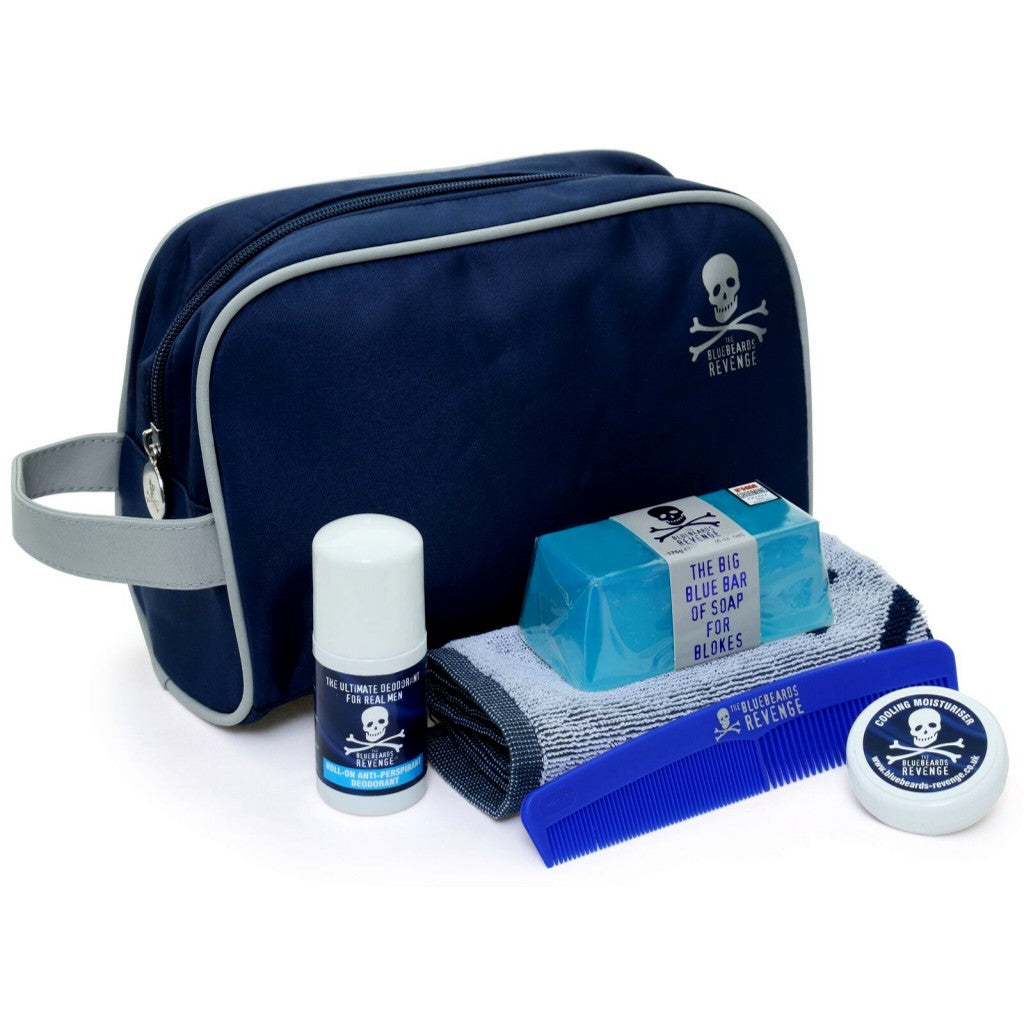 The Bluebeards Revenge Body Kit featuring a navy blue travel washbag, soap, deodorant, flannel, comb, and moisturiser sample for ultimate grooming on the go.