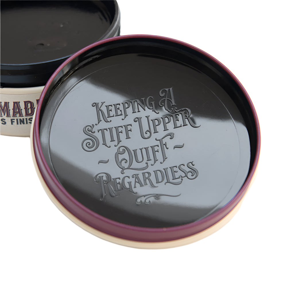 Jar lid with text 'Keeping a Stiff Upper Quiff Regardless' on a white background