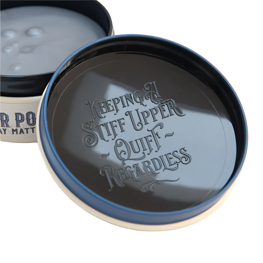 Jar lid with text 'Keeping A Stiff Upper Quiff Regardless' on a white background
