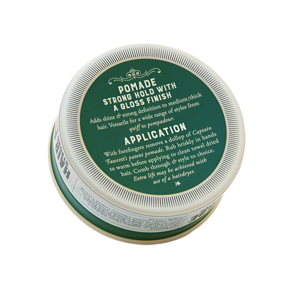 Jar of pomade with green label on a white background