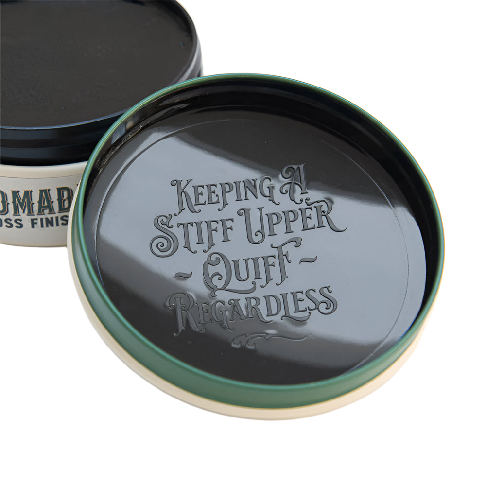 Jar lid with engraved text 'Keeping A Stiff Upper Quiff Regardless' on a white background