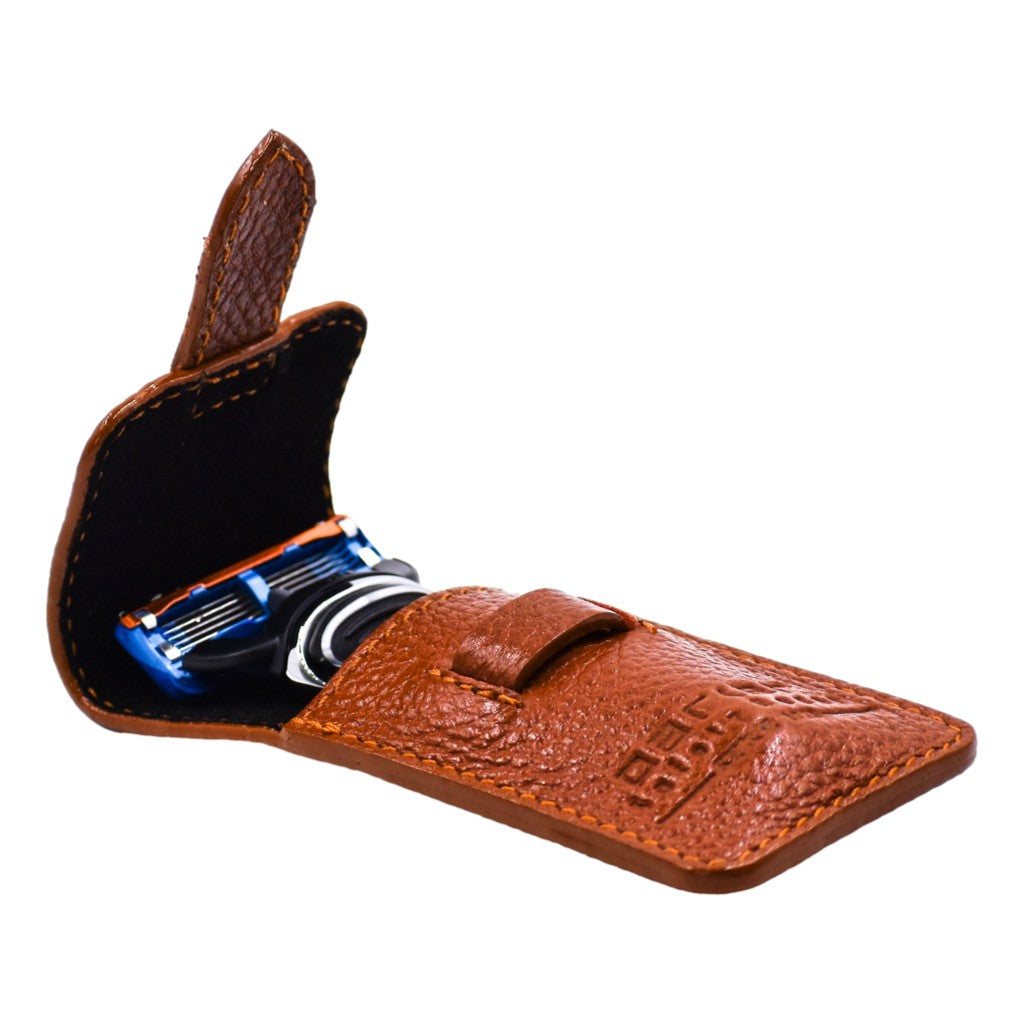Brown leather case with a blue and silver Fushion Blade inside on a white background