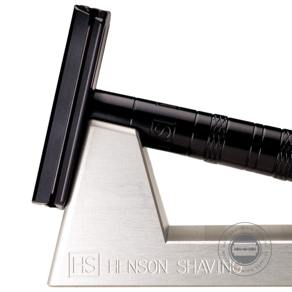 Henson Shaving Razor Stand holding a black Henson AL13 Safety Razor in a sleek and durable design.