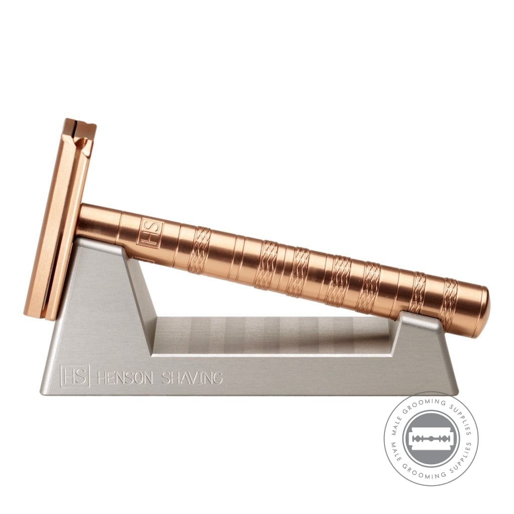Henson Razor Stand holding a copper Henson AL13 Safety Razor, showcasing its precision design and modern finish.