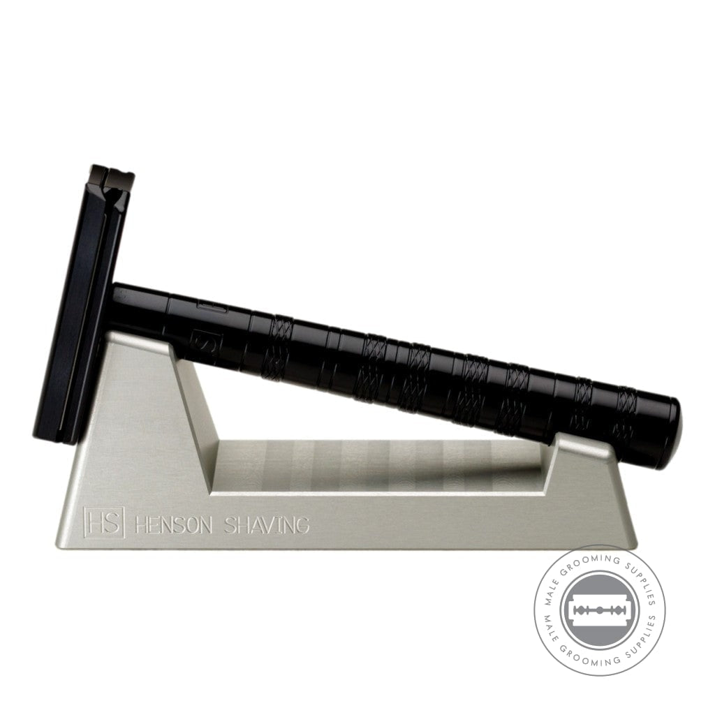 Henson Razor Stand holding a jet black Henson AL13 Razor, perfect for secure storage and adding a sleek touch to grooming areas.