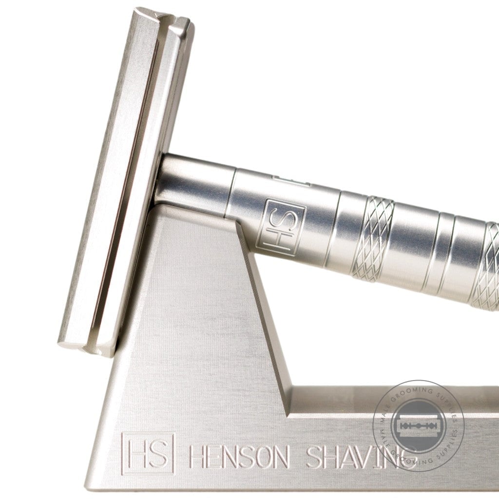 Close-up of the Henson Razor Stand with a safety razor, crafted from durable 6061-T651 aluminium for sleek razor storage.