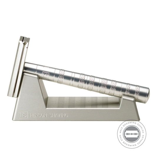 Side view of the Henson Razor Stand with a silver Henson AL13 Razor, showcasing its precision drying angle for optimal care.
