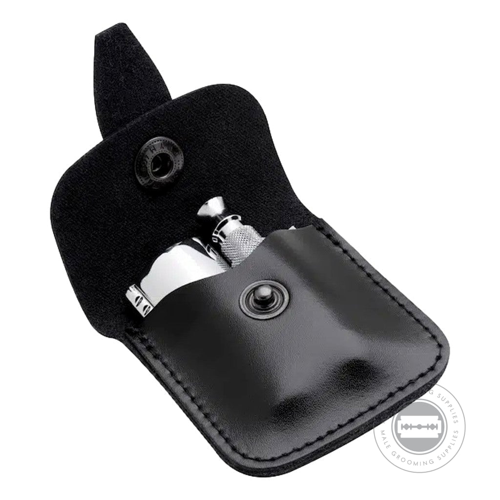 Open black leather case holding the Merkur Closed Comb Travel Razor 933000, ideal for keeping your shaving essentials organised during travel.