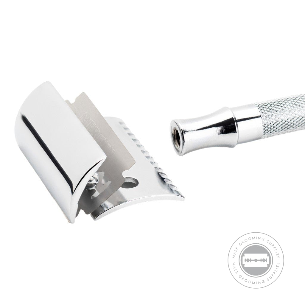 Merkur Long Handled Open Comb Double Edge Safety Razor 25001 disassembled, showcasing the blade, open comb head, and long handle in bright chrome finish.