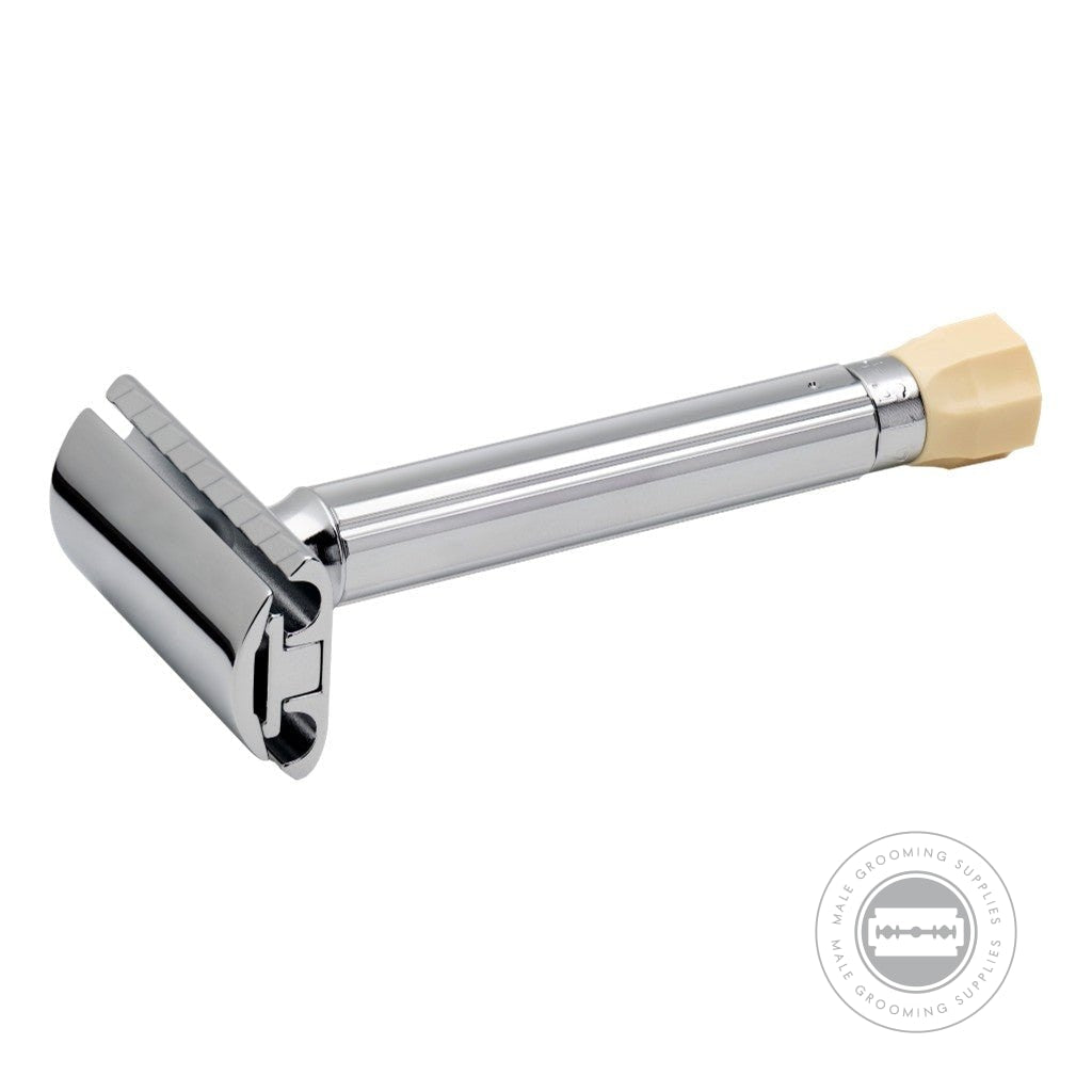 Close-up view of the Merkur Progress 510001 razor, showcasing the adjustable blade gap and long chrome handle with ivory-coloured dial.