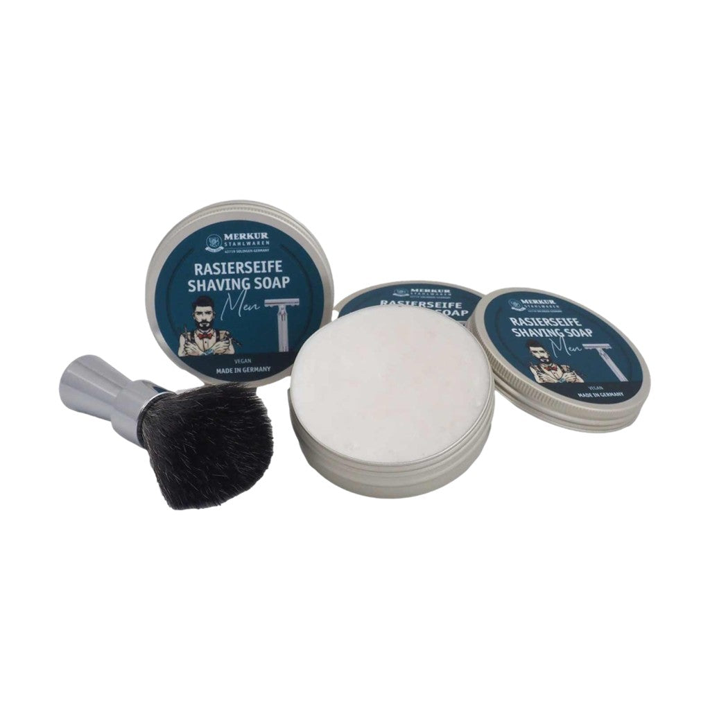 Merkur Men's Shaving Soap tins displayed with an open lid, emphasizing the soap's smooth texture and premium packaging.