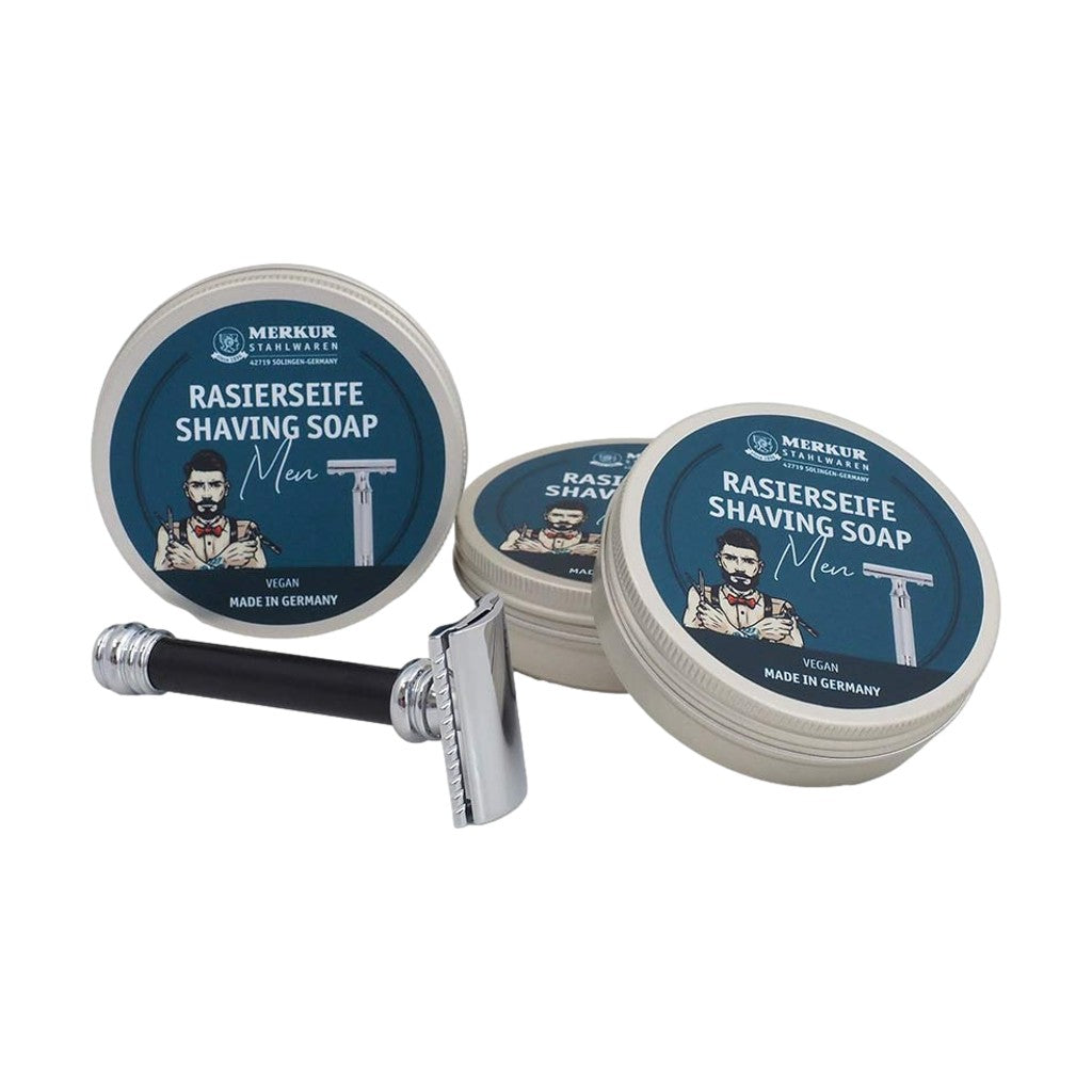 A collection of Merkur Men's Shaving Soap tins with a safety razor, highlighting the professional and elegant design.