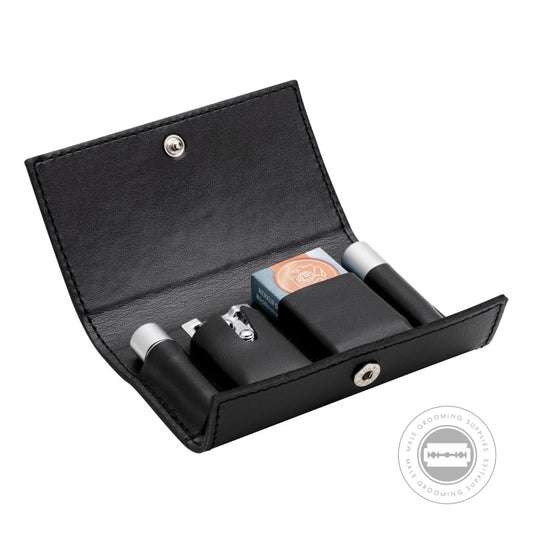 Angled view of the Merkur Travel Razor 46002 leather case, highlighting the organized layout with securely held razor components and blade storage.