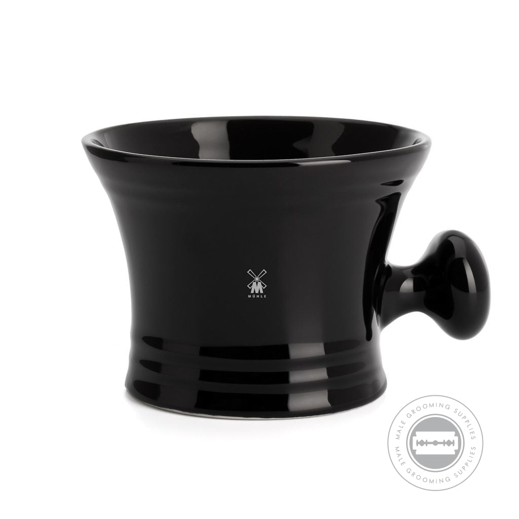 Side view of the MÜHLE Porcelain Black Shaving Mug, showcasing its sleek black porcelain finish, elegant design, and the MÜHLE logo.