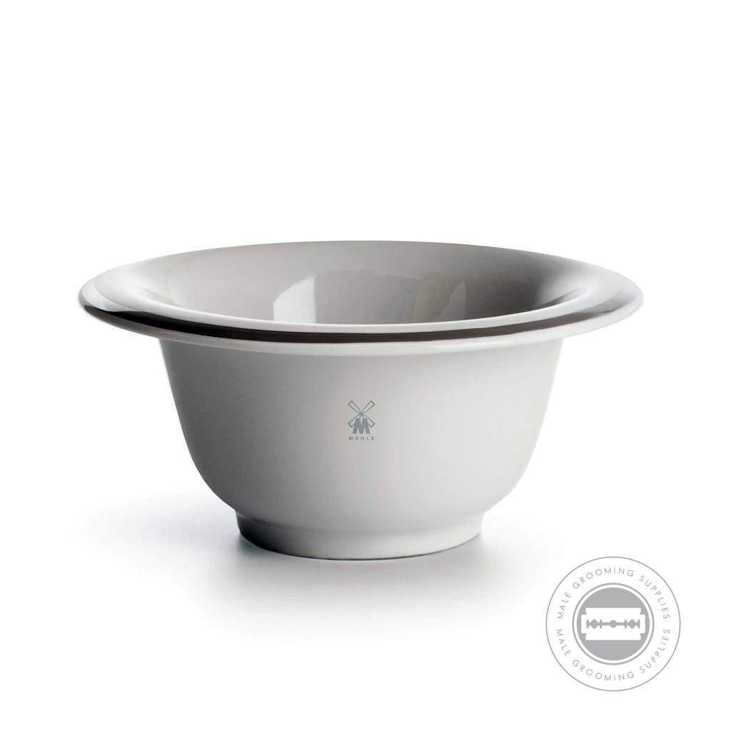 Side View of Muhle Porcelain White Shaving Bowl with Platinum Rim: A side profile of the Muhle porcelain white shaving bowl, highlighting its smooth porcelain finish, platinum rim, and iconic Muhle logo on the bowl’s exterior.