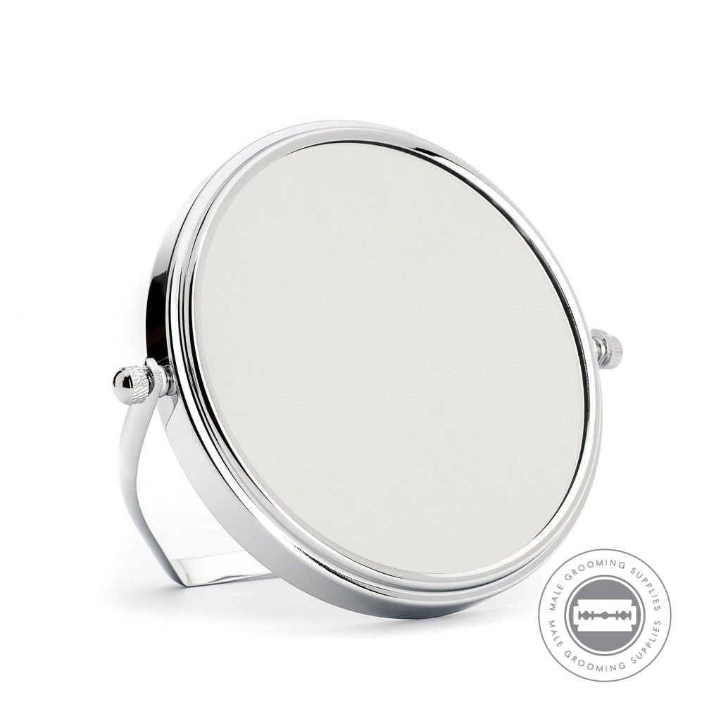 Muhle Shaving Mirror with chrome-plated frame, dual magnification, and sturdy stand for precise shaving.