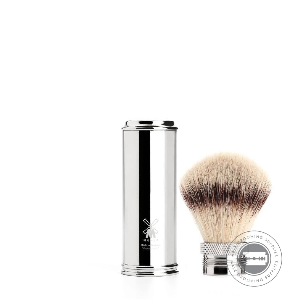 Muhle Travel Shaving Brush in Chrome with Silvertip Fibre® bristles, disassembled to show the compact storage design, featuring a shiny chrome-plated handle.