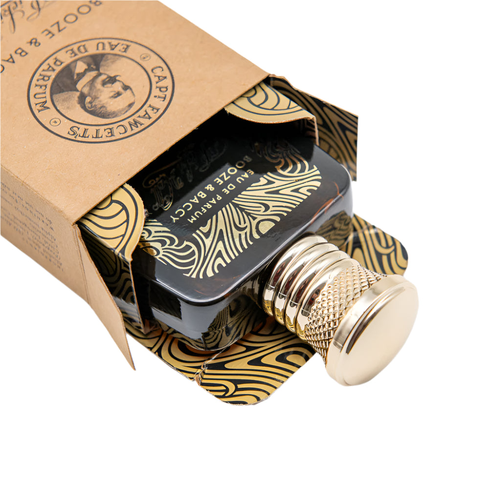 Captain Fawcett Booze & Baccy Eau De Parfum 50ml Glass Bottle With Warm Tobacco And Bay Rum Scent with gold accents in a branded box on a white background