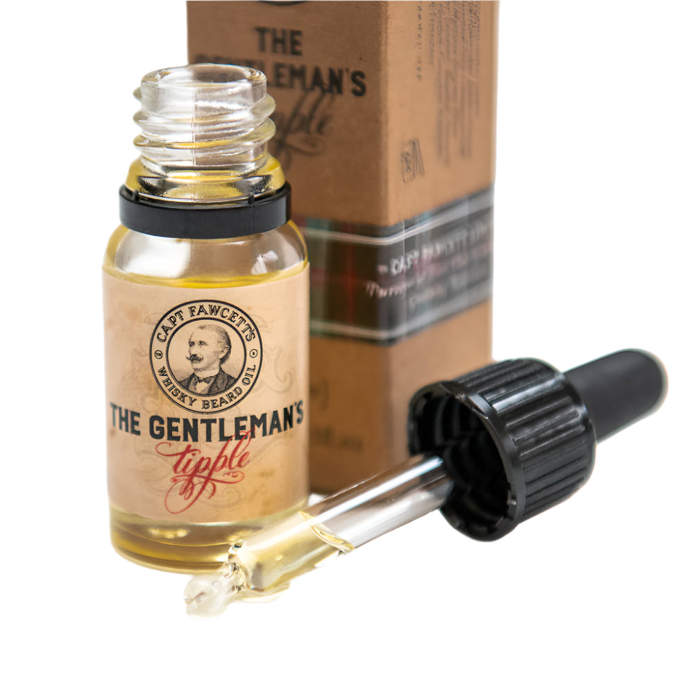 Bottle of 'The Gentleman's Tipple' whiskey beard oil with dropper on a white background
