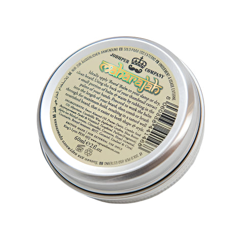 Jar of beard balm with label and silver lid on a white background