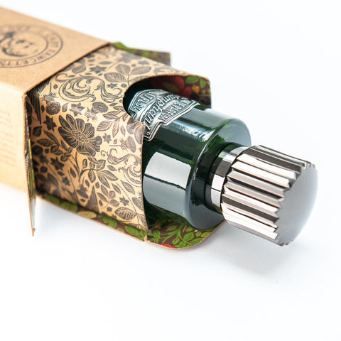 Perfume bottle with decorative packaging on a white background