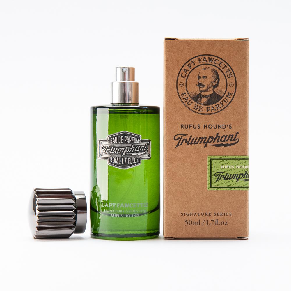 Green perfume bottle with silver cap and brown cardboard box labeled 'Cape Fawcett' on a white background