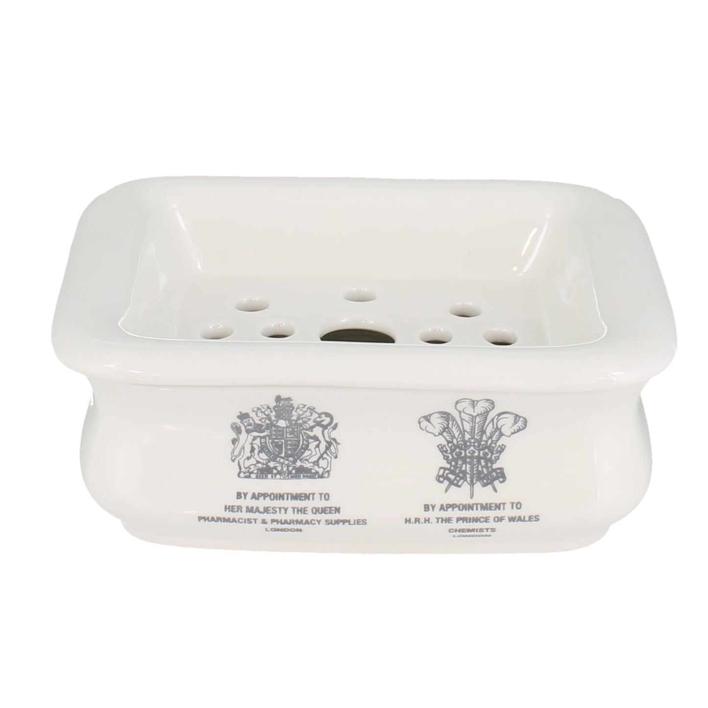 White soap dish with engraved designs on a white background