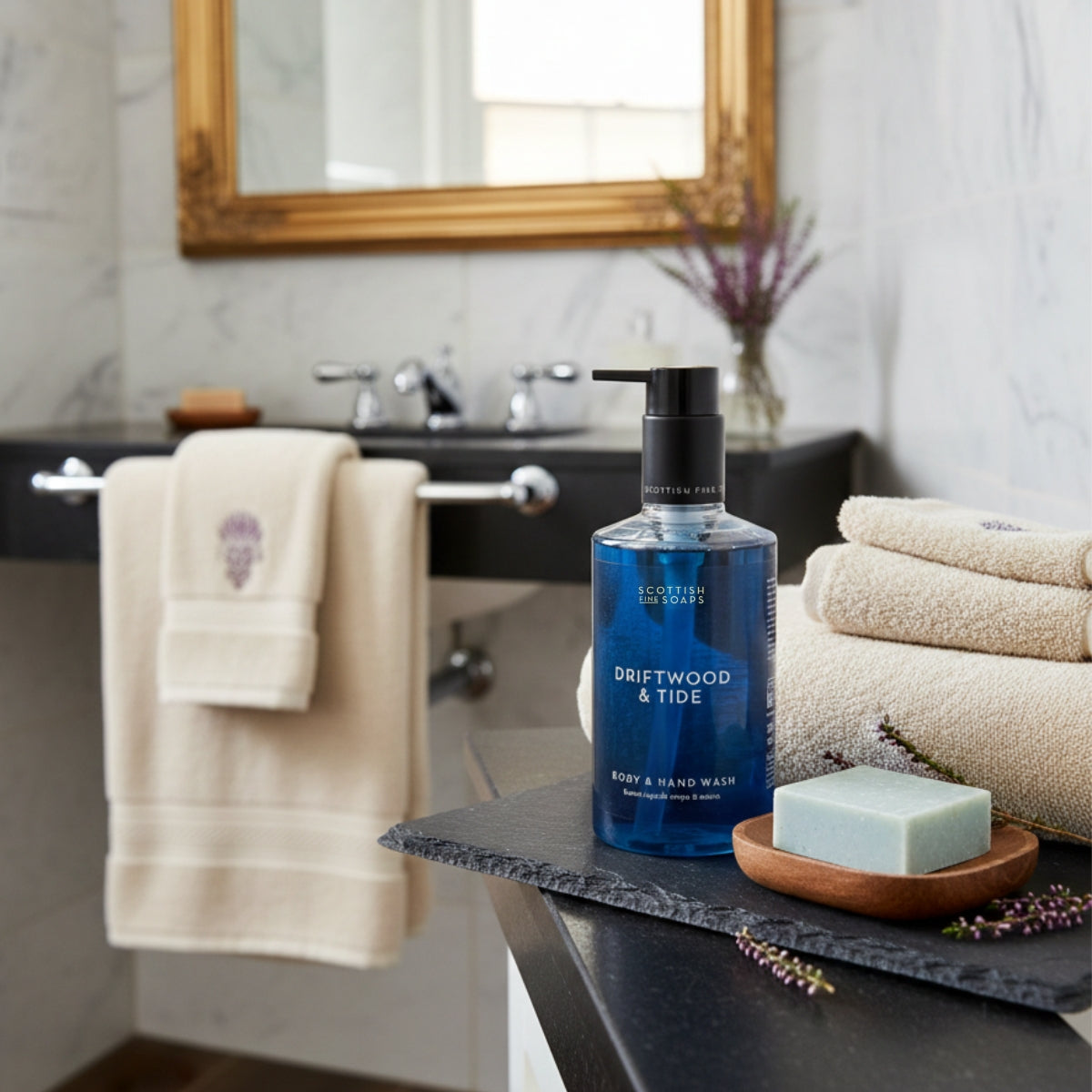 Driftwood & Tide Body & Hand Wash with soap and towels on a bathroom surface