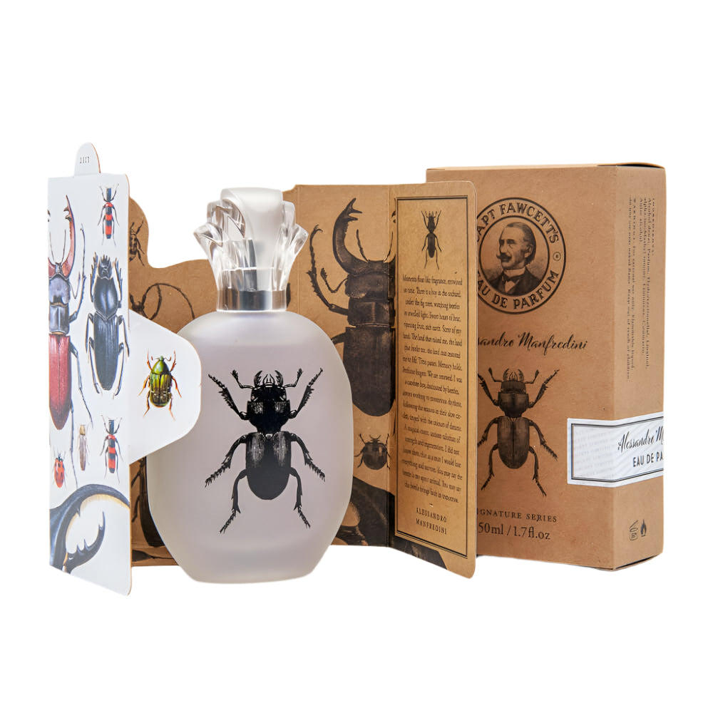 Perfume bottle with beetle design and matching packaging on a white background