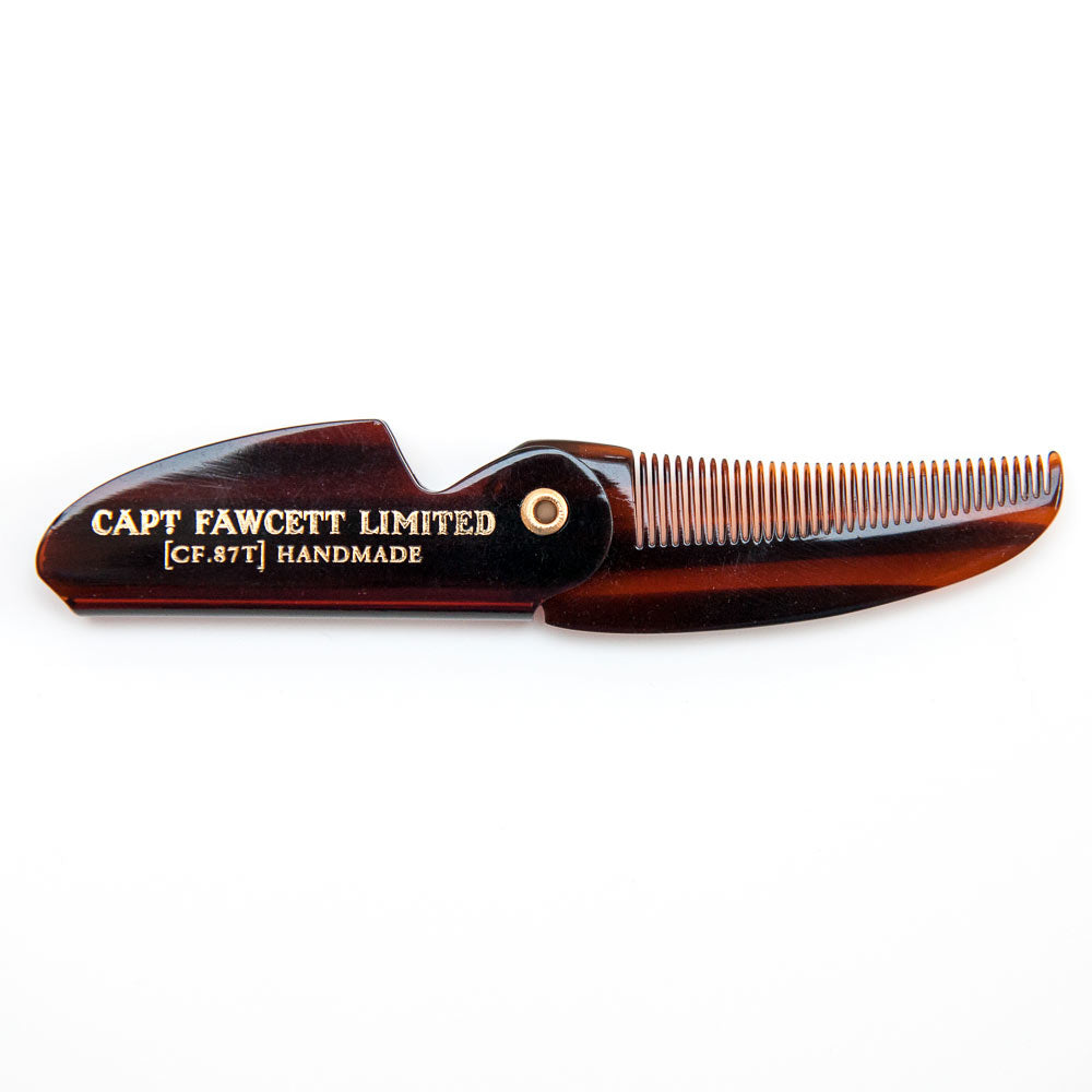 Tortoiseshell comb with 'Captain Fawcett Limited' branding on a white background
