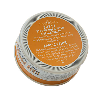 Jar of hair putty with orange label on a white background