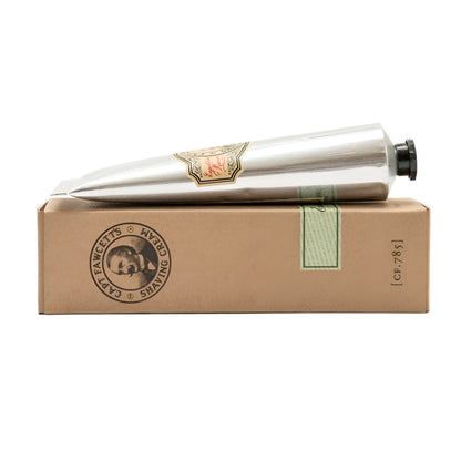 Silver cylindrical product on a cardboard box with branding on a white background