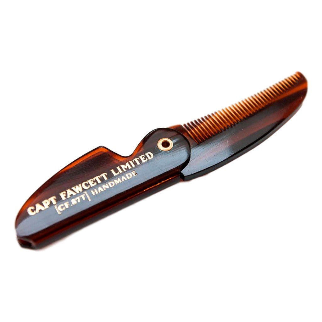 Folding comb on a white background, branded 'Captain Fawcett Limited'.