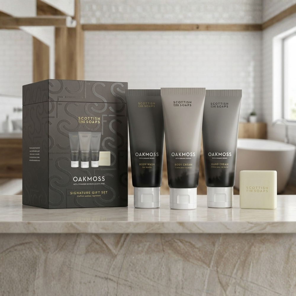 Oakmoss Signature Gift Set showing body wash, body cream, hand cream and soap beside a basin