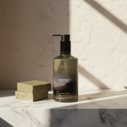 Oakmoss Hand Wash on a stone surface beside a sunny bathroom window