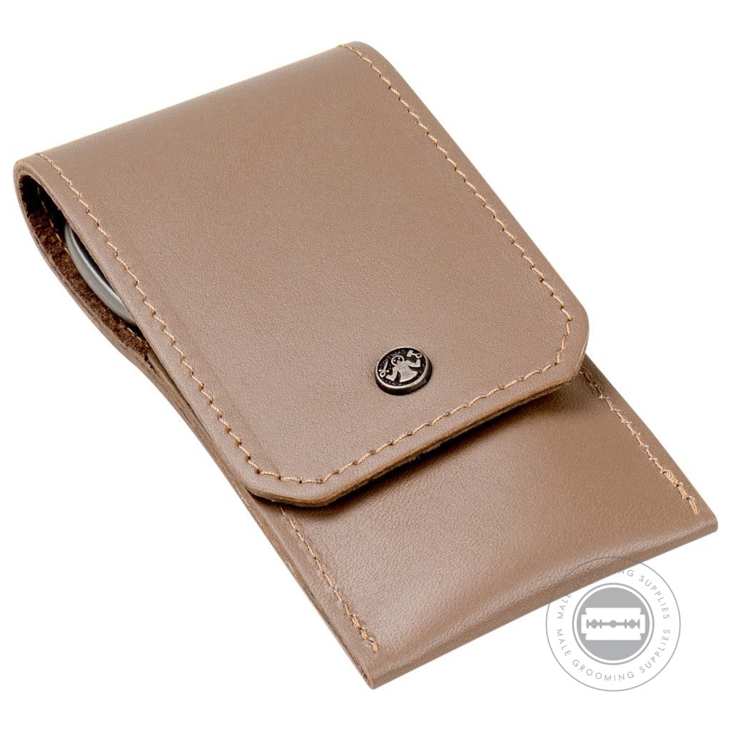 Dovo Taupe Leather Manicure Set closed with beige stitching and metal logo.