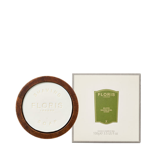 Floris Elire soap in a wooden dish with its packaging on a white background