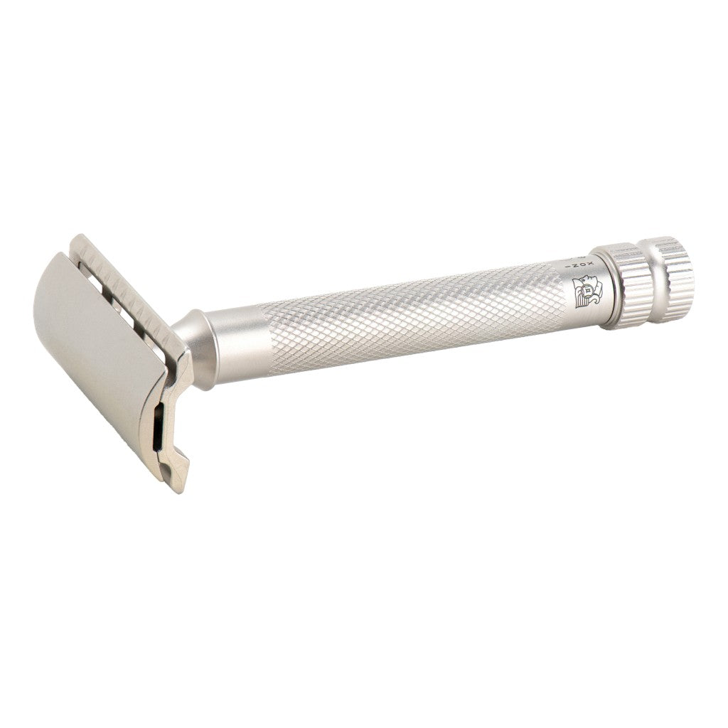 A stainless steel safety razor with a textured handle shown on a plain white background.