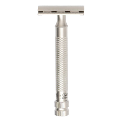 A silver stainless steel double-edge safety razor with a textured grip handle and a rectangular head, shown vertically against a plain white background.