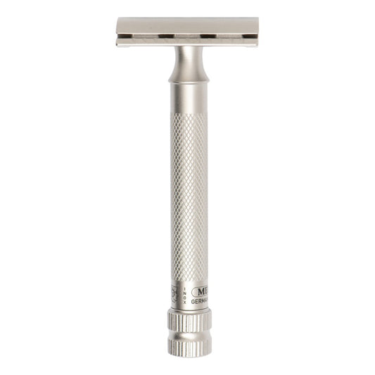 A silver stainless steel double-edge safety razor with a textured grip handle and a rectangular head, shown vertically against a plain white background.