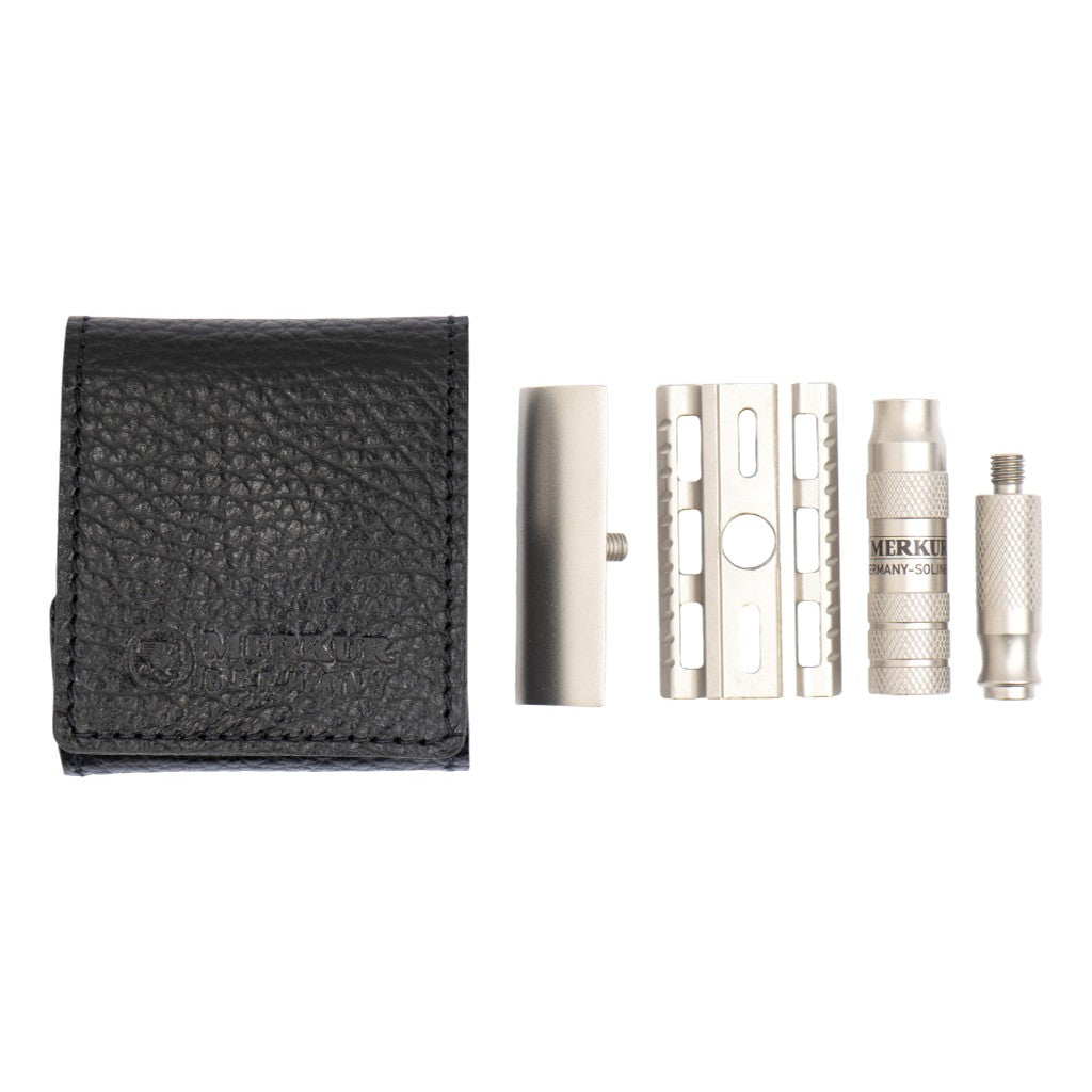 Disassembled Merkur 933 INOX travel razor components beside the black leather case