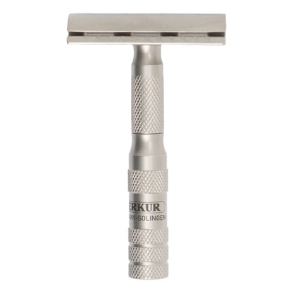 A silver metal safety razor with a textured knurled handle and a rectangular head, featuring the brand name 'MERKUR' printed on the side, set against a plain white background.