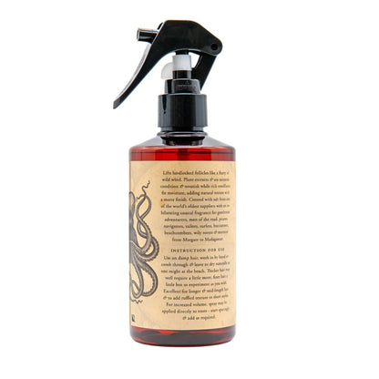 Spray bottle with a decorative label on a white background