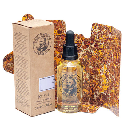 Bottle and box of Captain Fawcett beard oil with decorative packaging on a white background