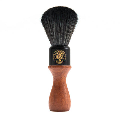 Shaving brush with black bristle head and wooden handle on a white background